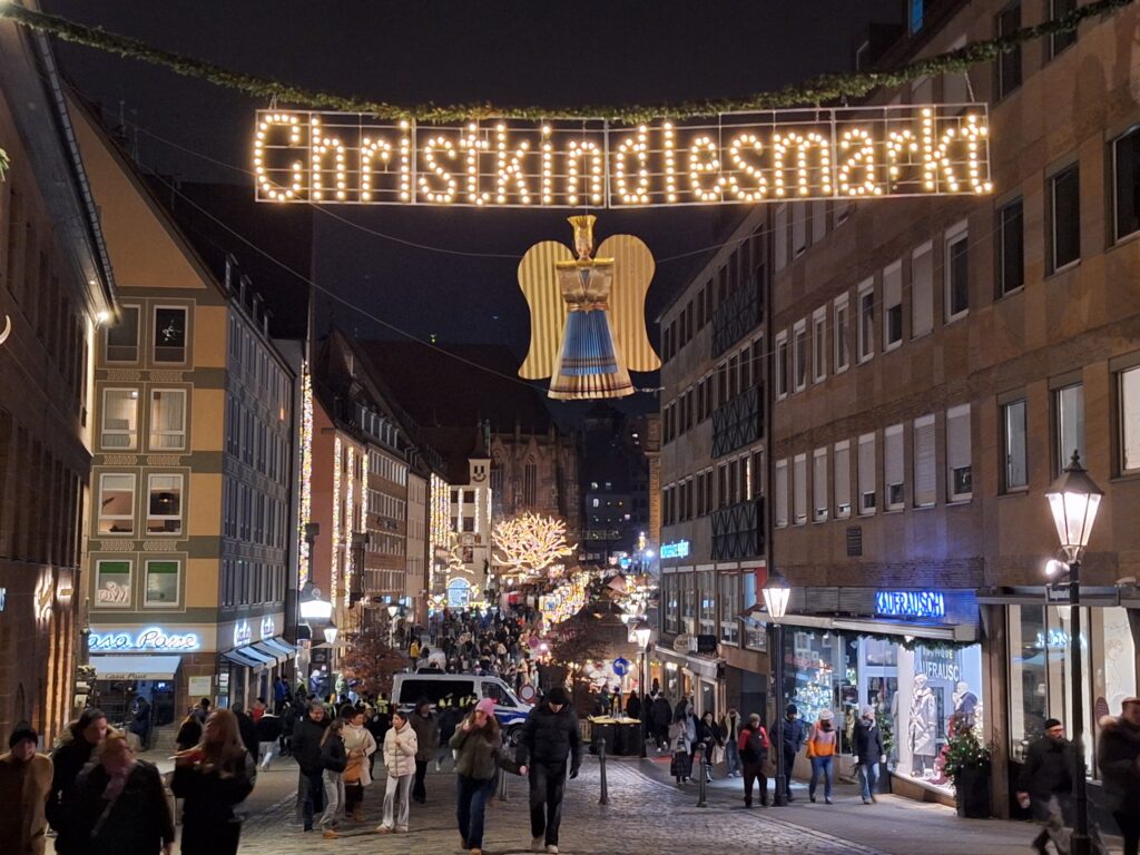 An image of Hauptmarkt street in Nuremberg with a Christkindlesmarkt banner